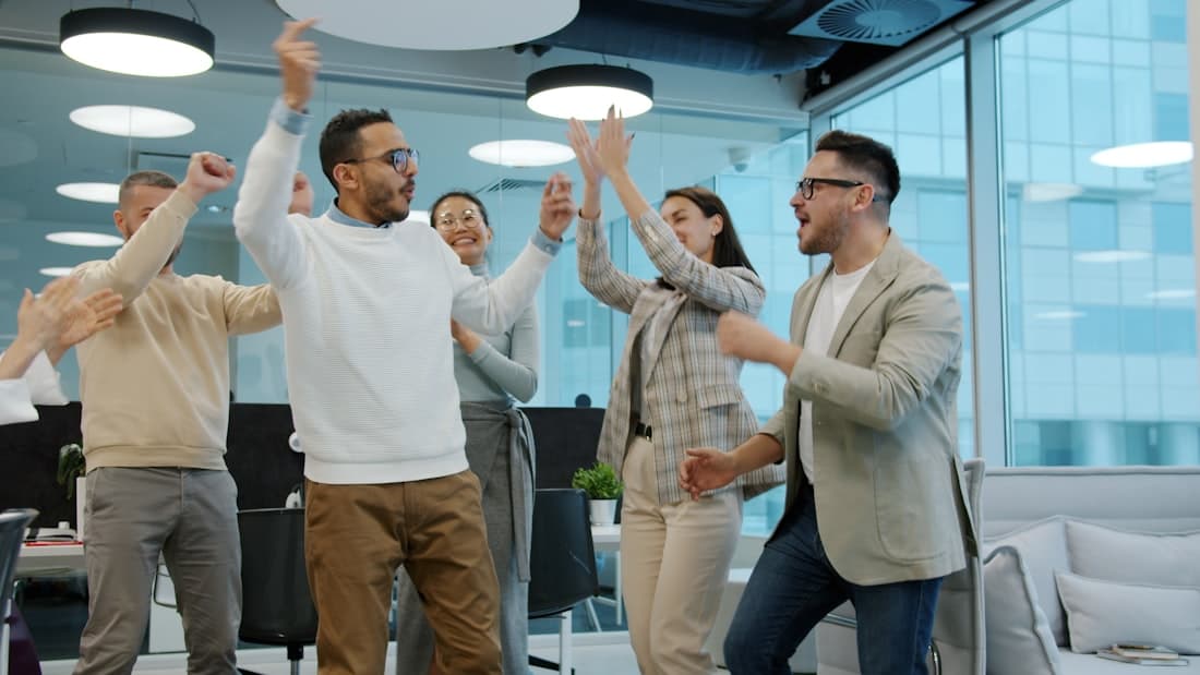 A team celebrating their winning round